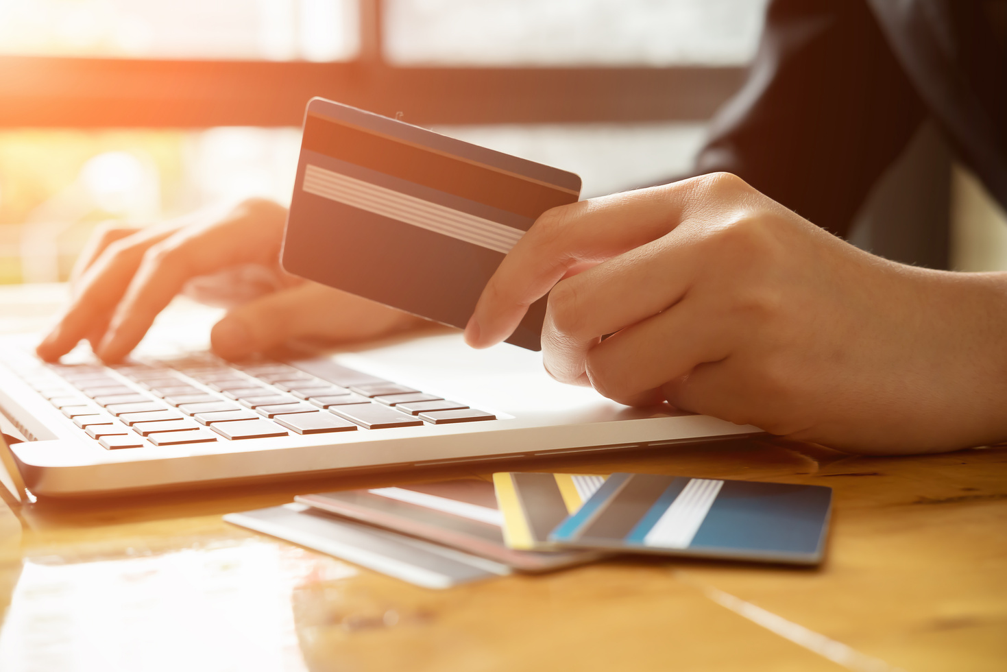 Person Paying for Online Transaction with Card